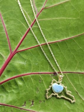 Gold-Plated Map Pendant Necklace with Light Blue Heart Stone